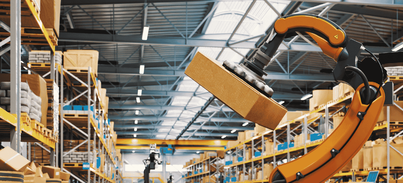 Robotic arm picking up box in factory