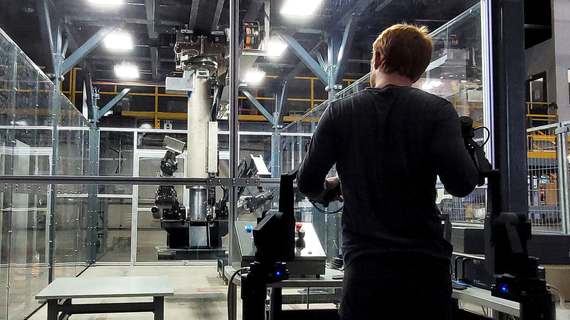 Person controlling robot arm remotely
