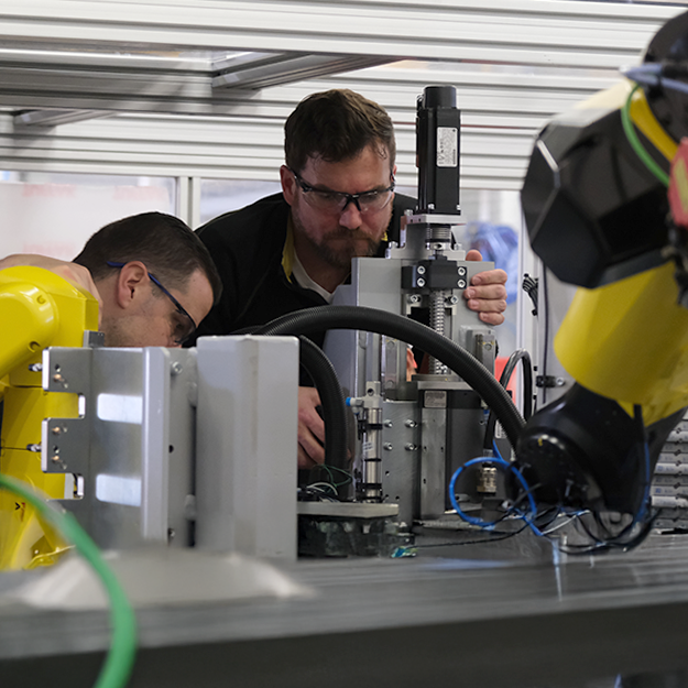 Automation Service and support technicians working on automation equipment