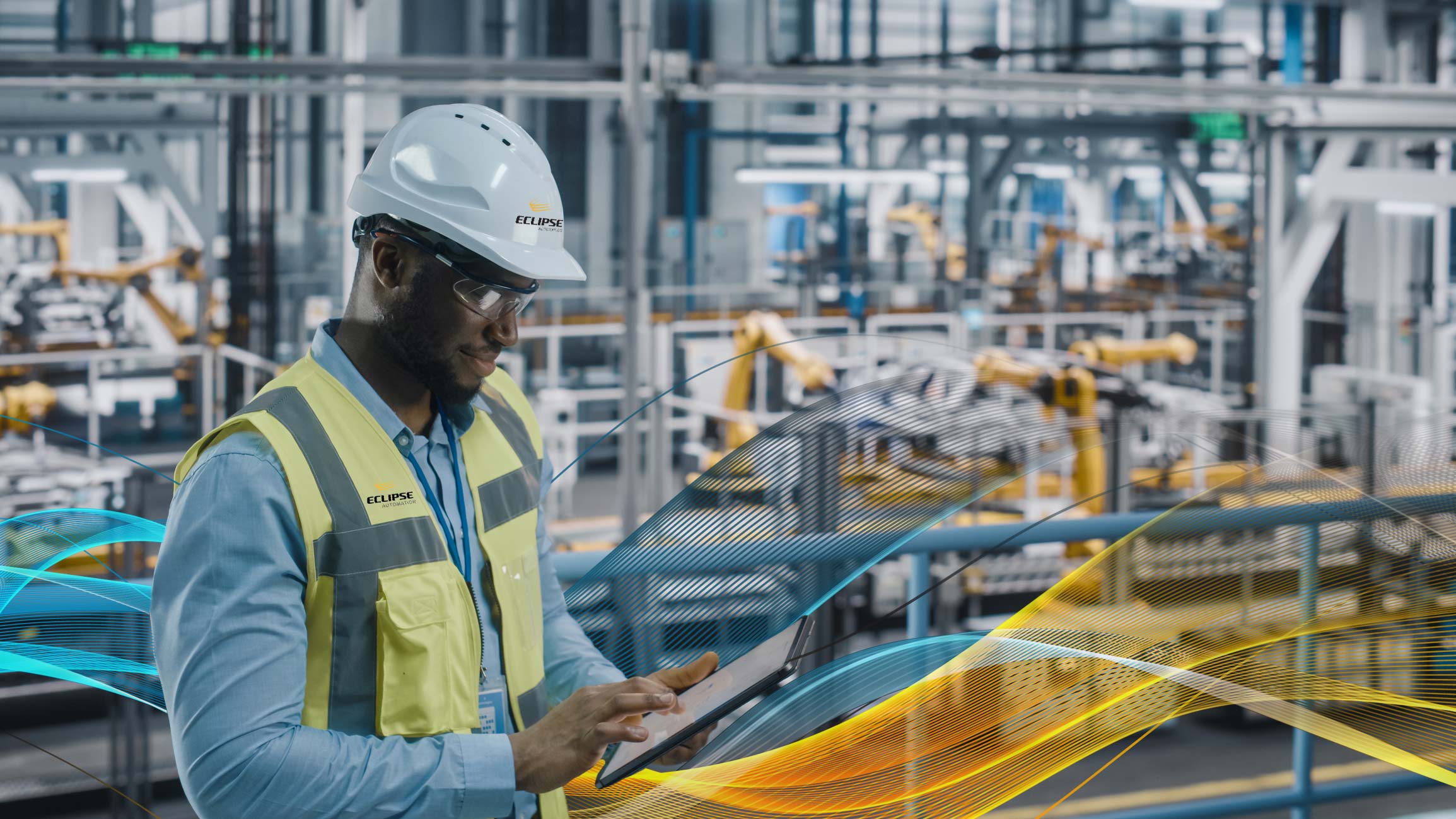 Engineer in factory on tablet